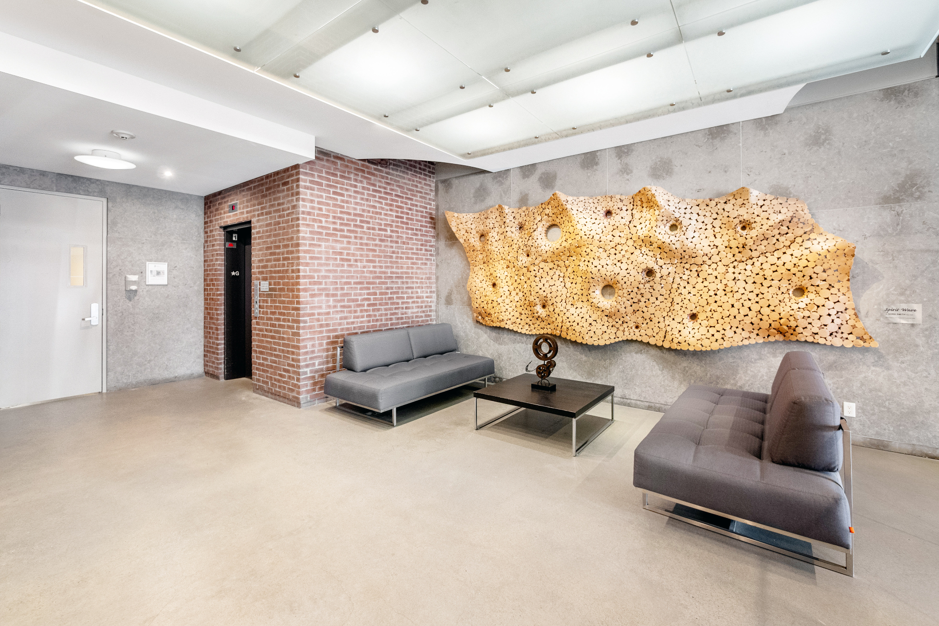 Building lobby seating with wood art wall