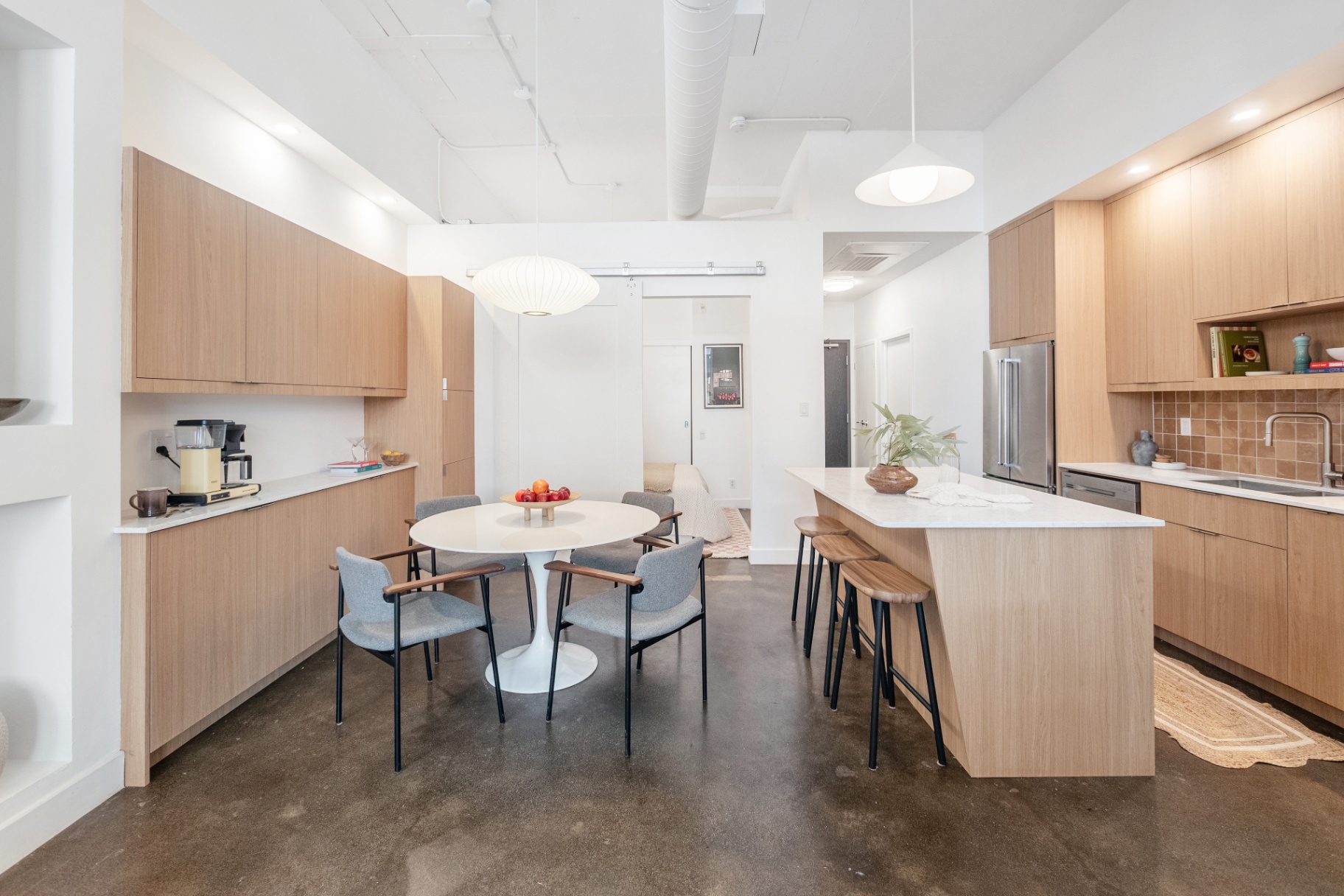 Wide view of kitchen, dining and hallway