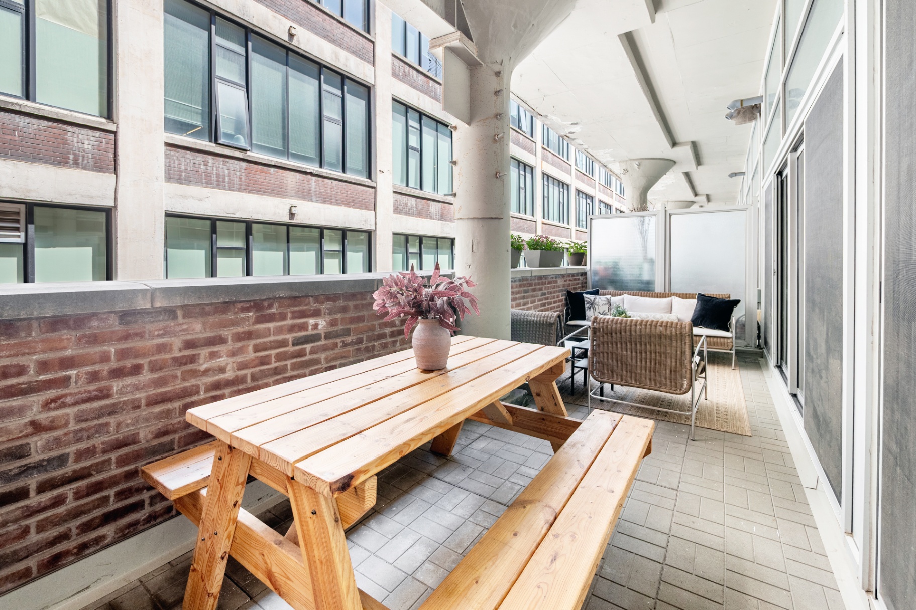 Long view of terrace with dining and lounge