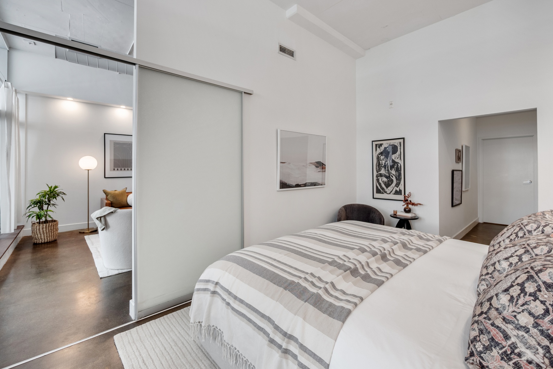 Bedroom with sliding glass door to living area