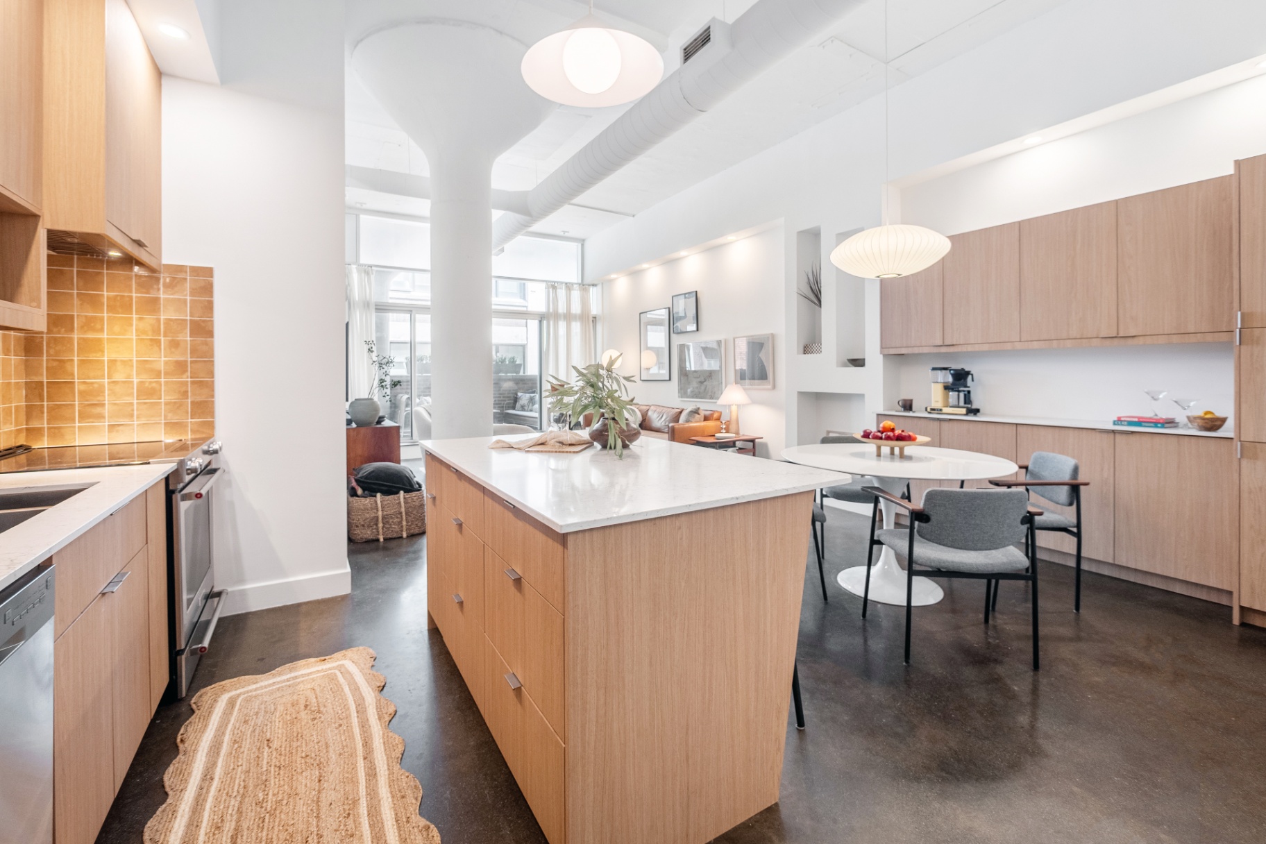 Kitchen with terracotta backsplash and island