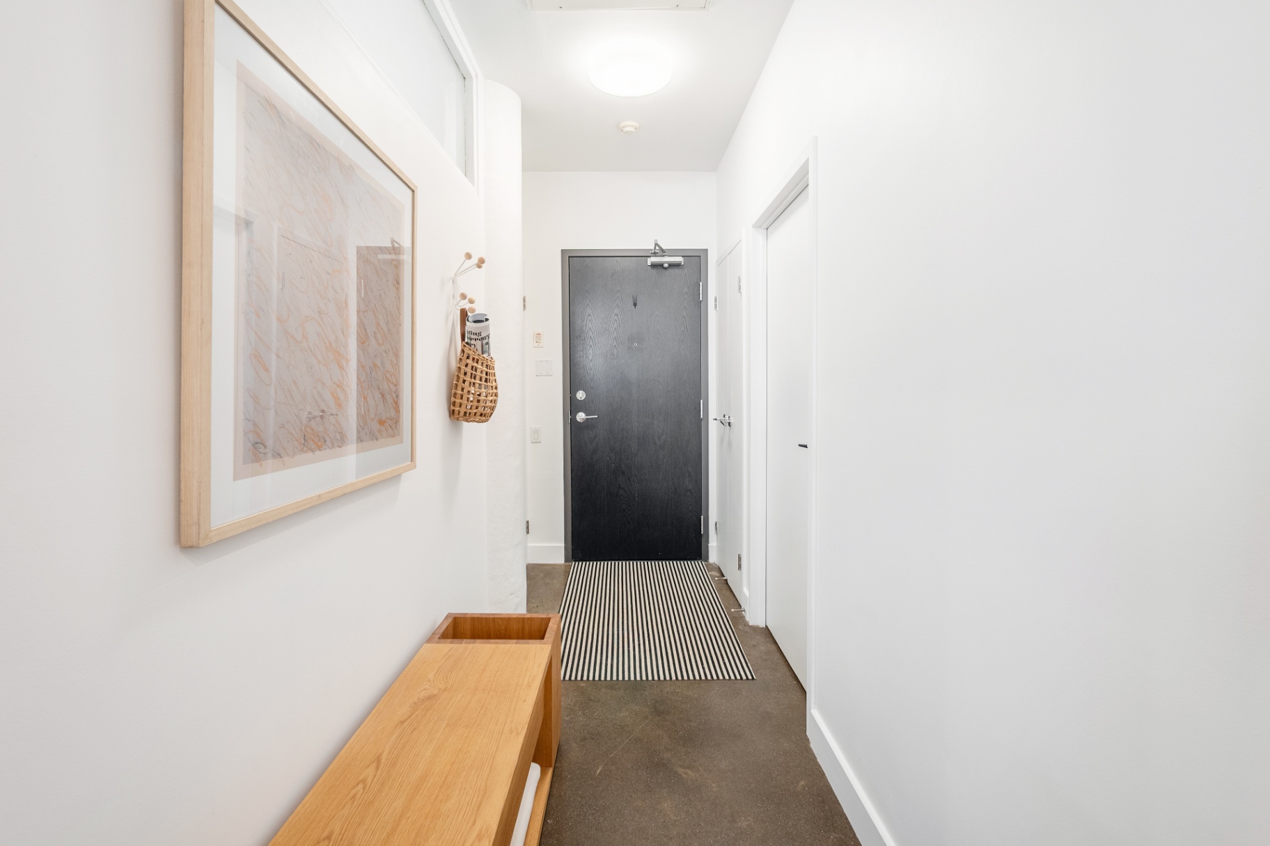 Entryway hallway with framed art