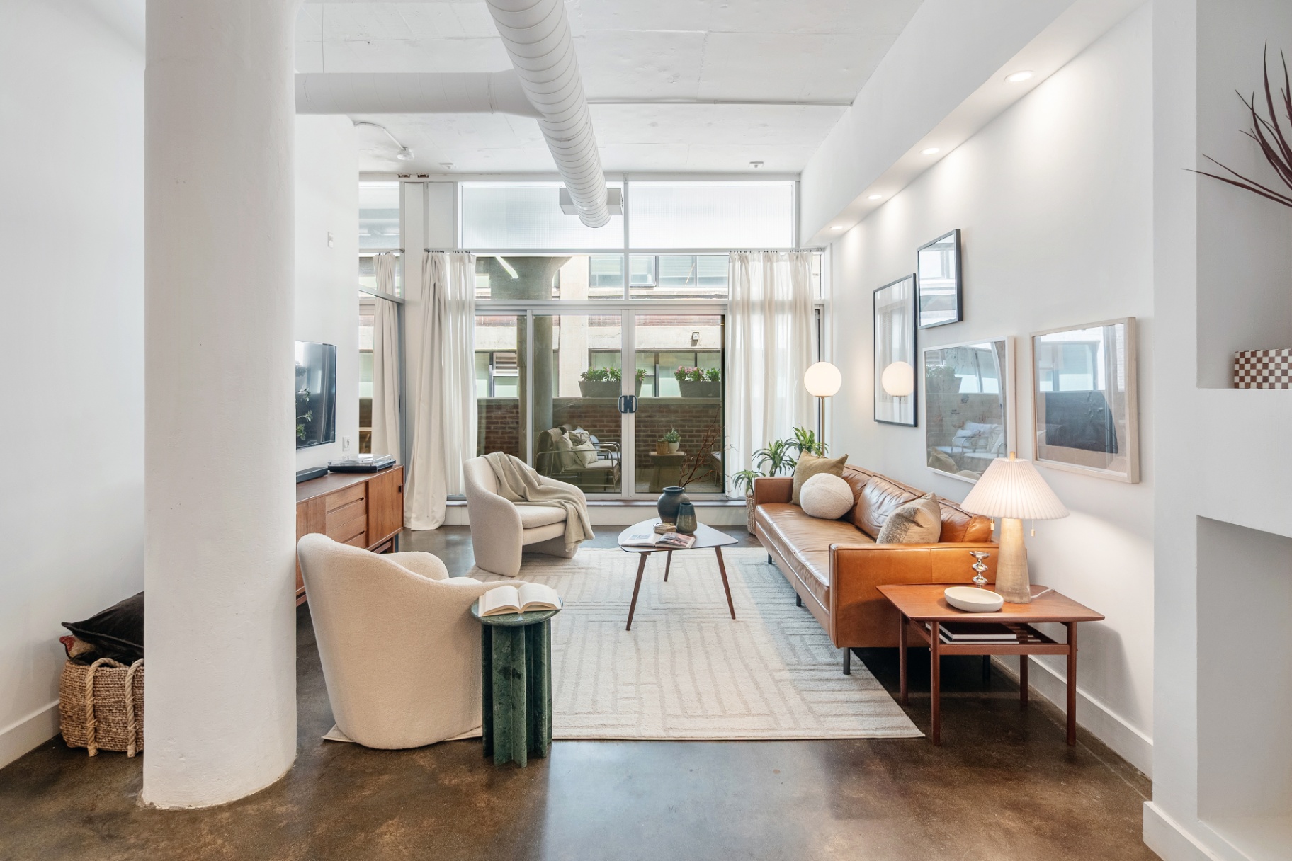 Living room looking toward walkout balcony