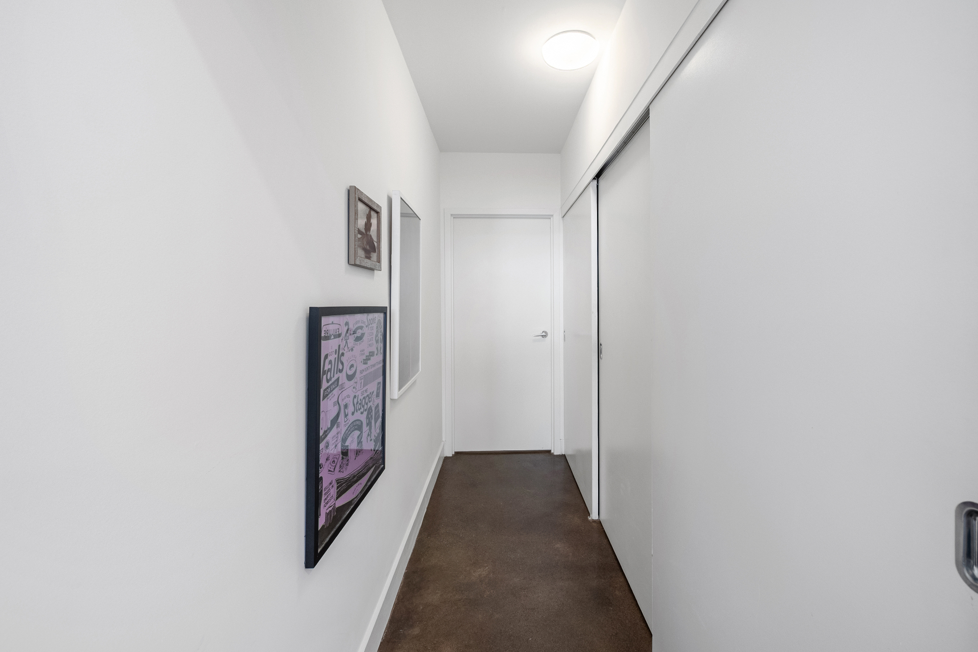 Hallway with art and closet