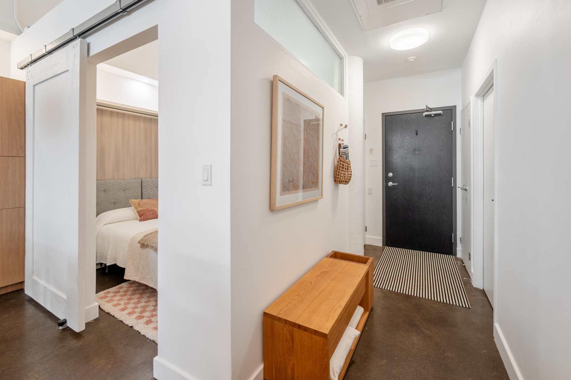 Entry hallway with barn door and bench