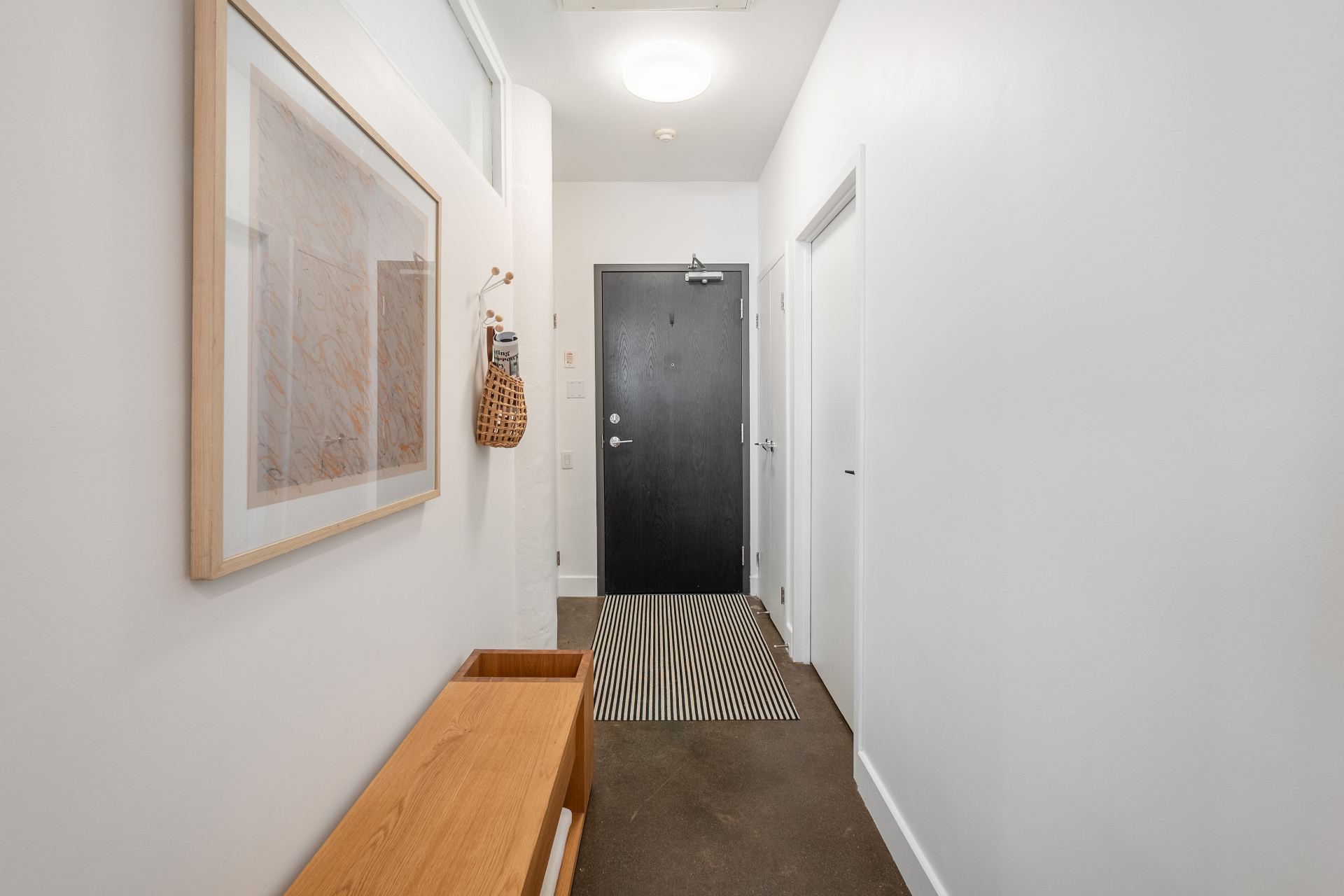 Front entry corridor with art and runner