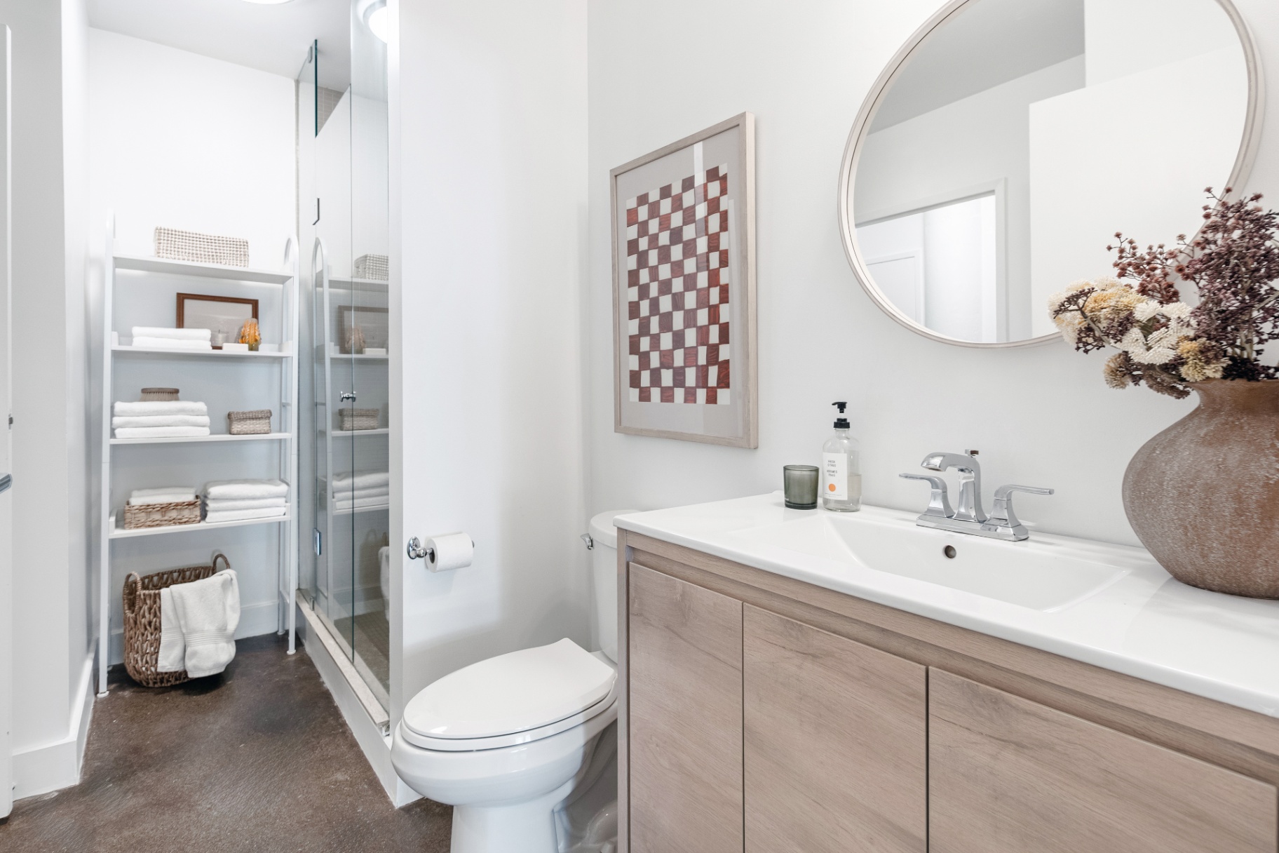 Bathroom with round mirror and shower