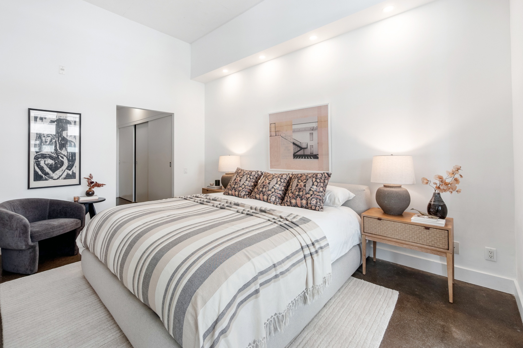 Primary bedroom with striped bedding