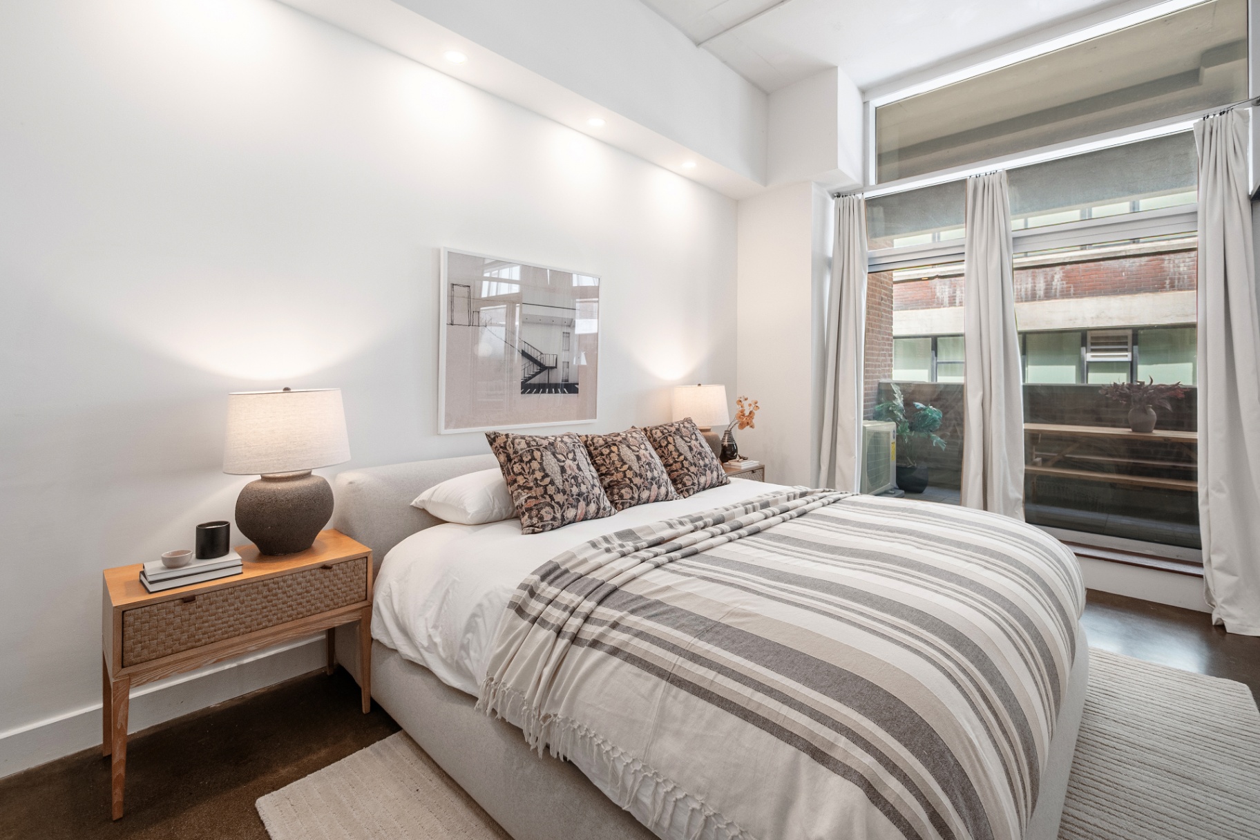 Bedroom with floor-to-ceiling window
