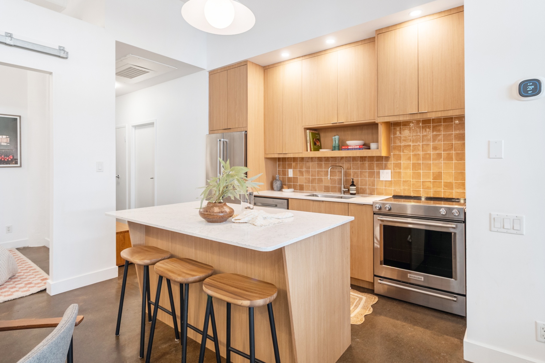 Kitchen with stainless range and island