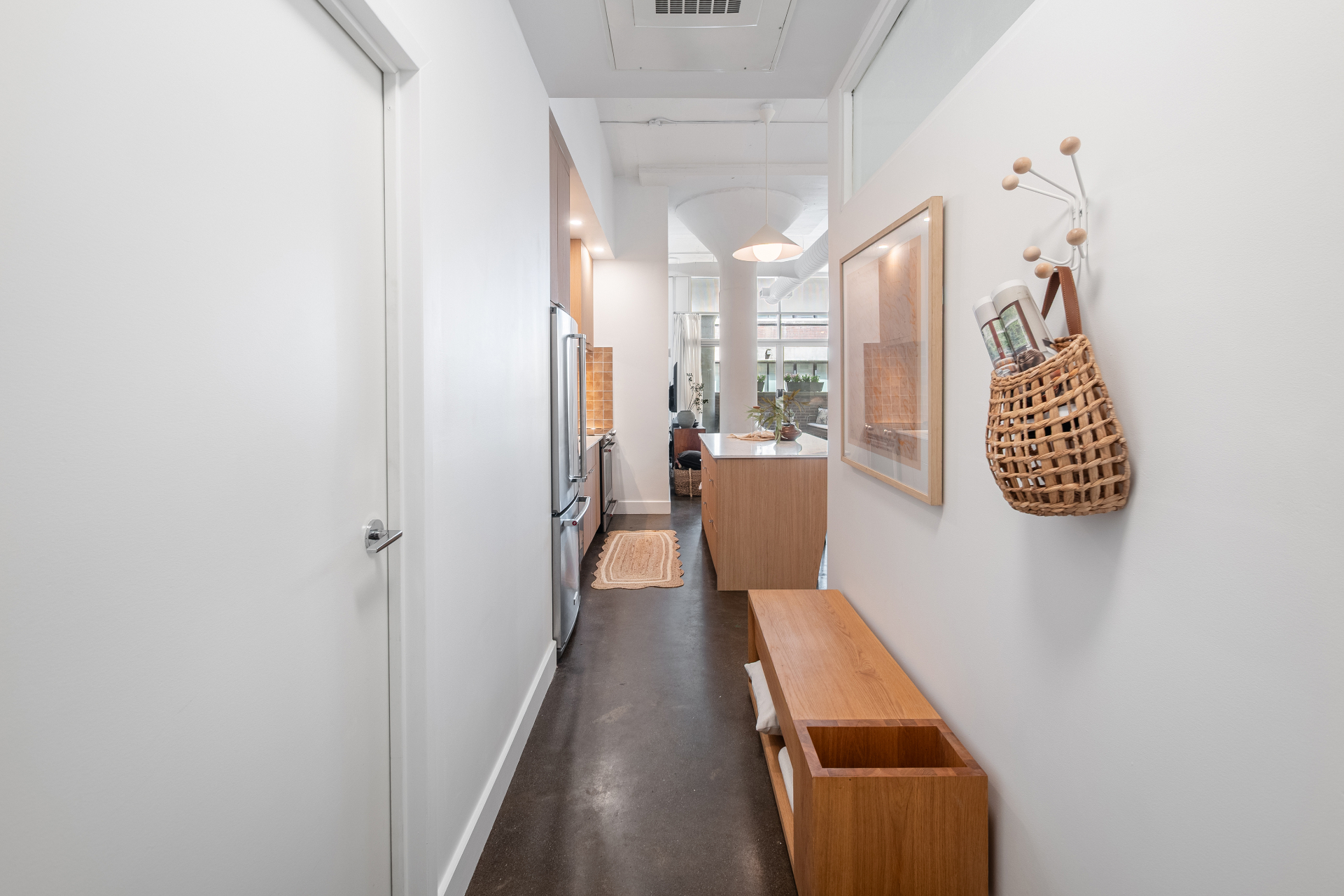 View from entry toward kitchen and living area