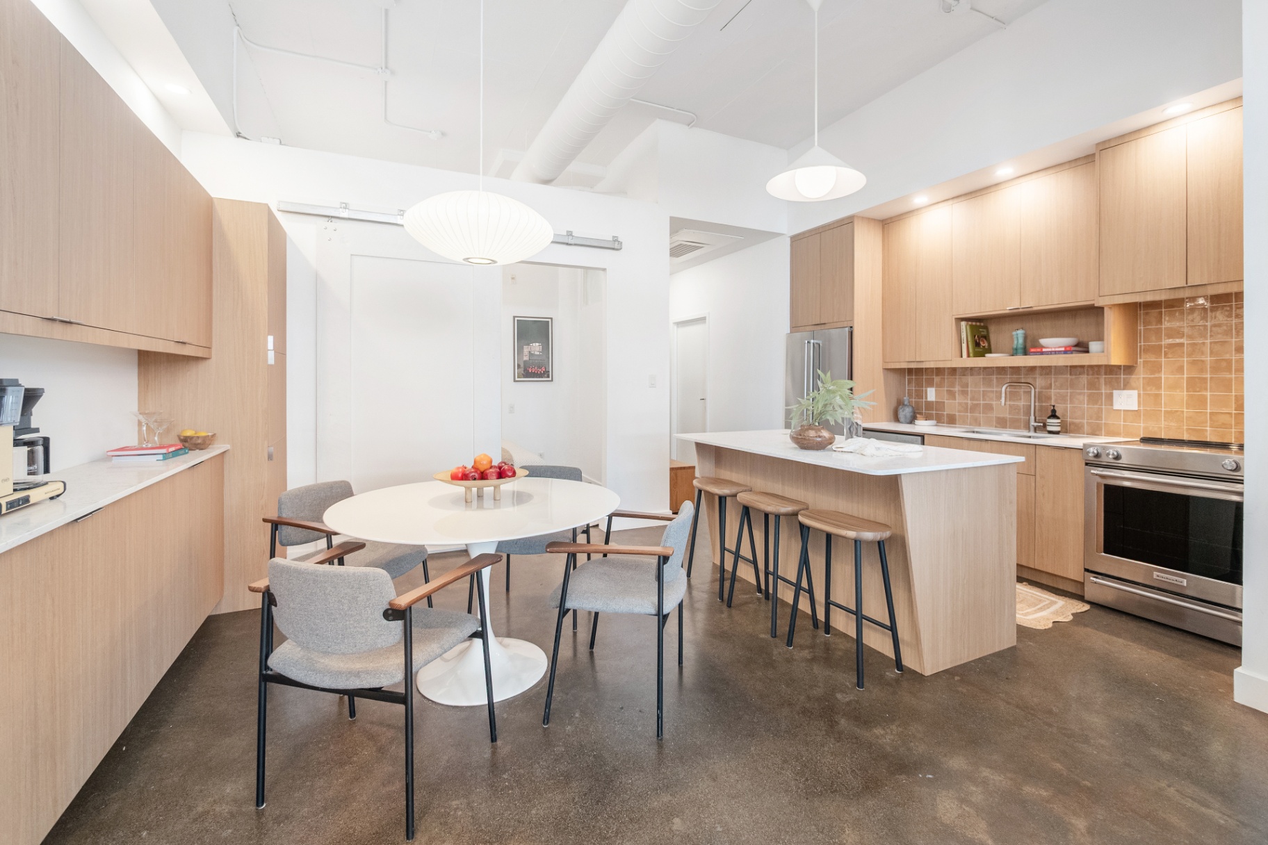 Kitchen and dining area with pendant lights